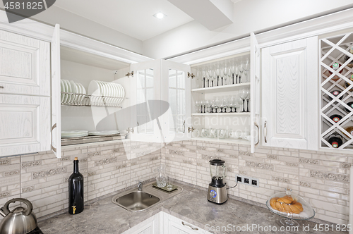 Image of modern white wooden kitchen interior