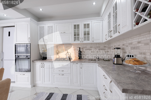 Image of modern white wooden kitchen interior