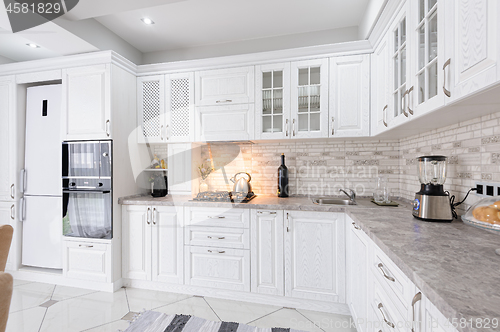 Image of modern white wooden kitchen interior