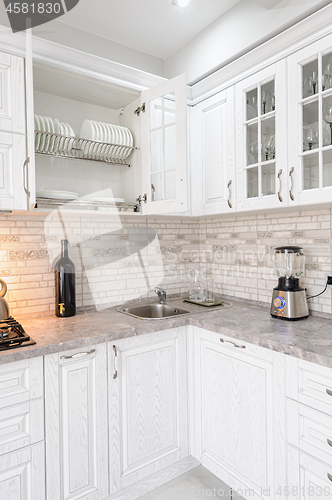 Image of modern white wooden kitchen interior