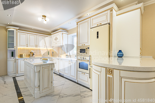 Image of neoclassic style luxury kitchen interior with island