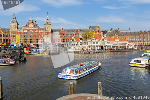 Image of Sightseeng at Canal Boats next tot Central Station of Amsterdam