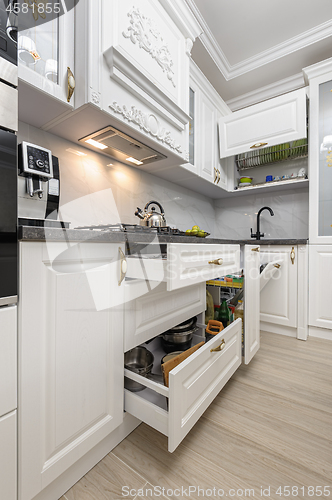 Image of White luxury modern kitchen with island