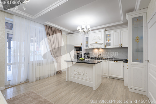 Image of White luxury modern kitchen with island