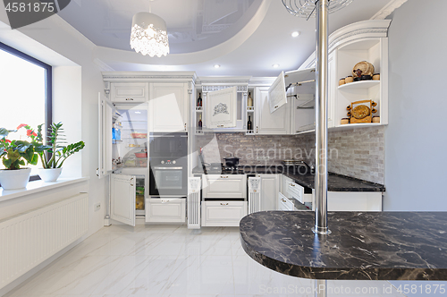 Image of Luxury modern white colored kitchen interior