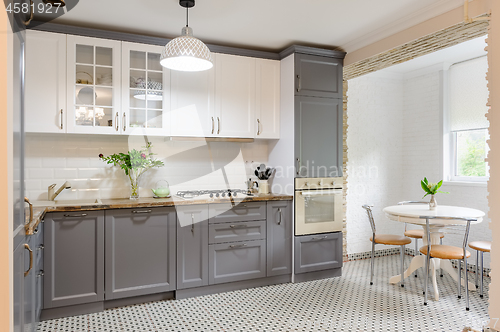 Image of modern grey and white wooden kitchen interior