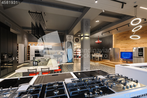 Image of Brand new gas stoves in apliance store showroom
