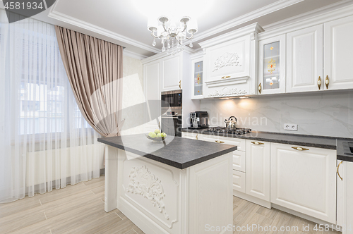 Image of White luxury modern kitchen with island