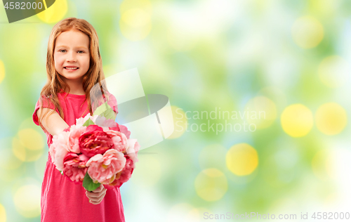 Image of happy red haired girl with flowers