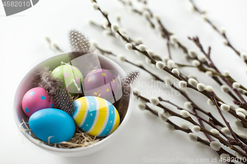 Image of colored easter eggs and pussy willow branches