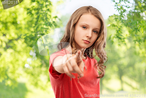 Image of teenage girl in red t-shirt pointing finger to you