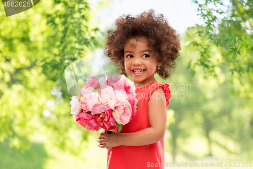 Image of happy little african american girl with flowers