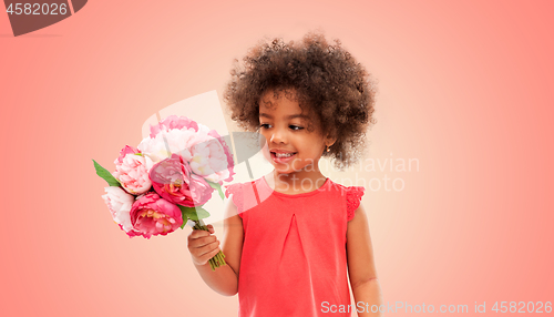 Image of happy little african american girl with flowers