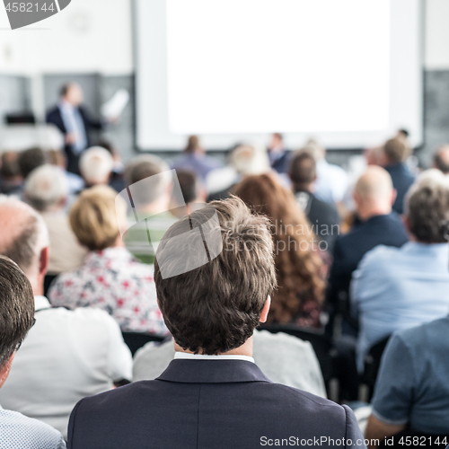 Image of Business speaker giving a talk at business conference event.