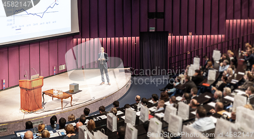 Image of Speaker giving presentation on business conference event.