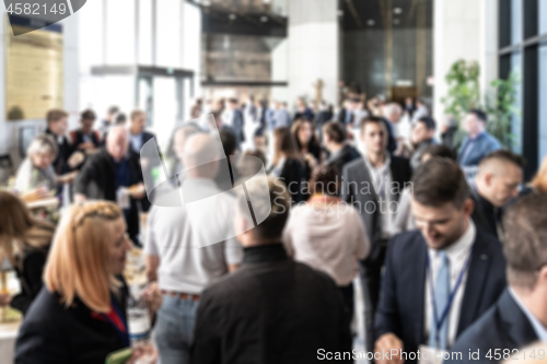 Image of Abstract blured photo of business people socializing during banquet lunch break break at business meetin, conference or event