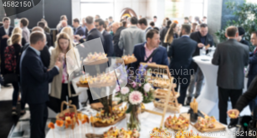 Image of Abstract blured photo of business people socializing during banquet lunch break break at business meetin, conference or event