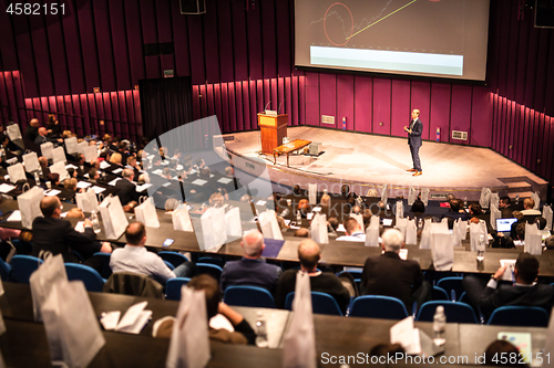 Image of Speaker giving presentation on business conference event.