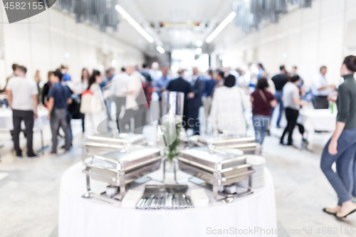 Image of Blured image of businesspeople at coffee break at conference meeting.