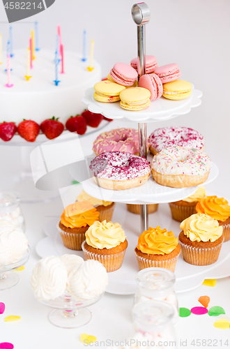 Image of food and drinks on table at birthday party