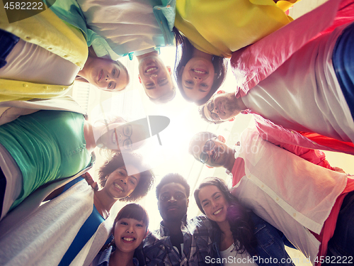 Image of group of international students standing in circle