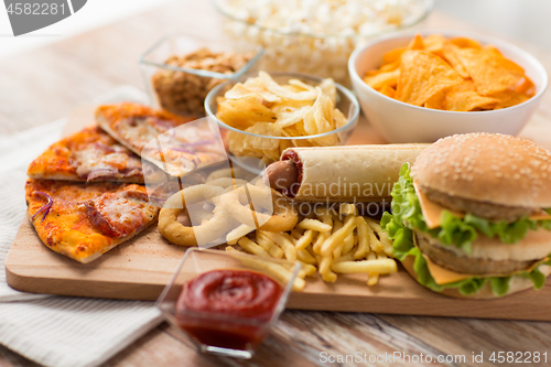 Image of close up of fast food on wooden board