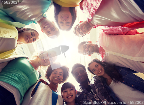 Image of group of international students standing in circle