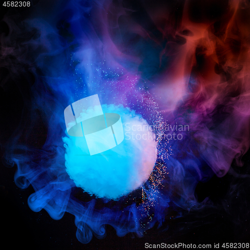 Image of Splash of colorful smoke in ultraviolet colors.