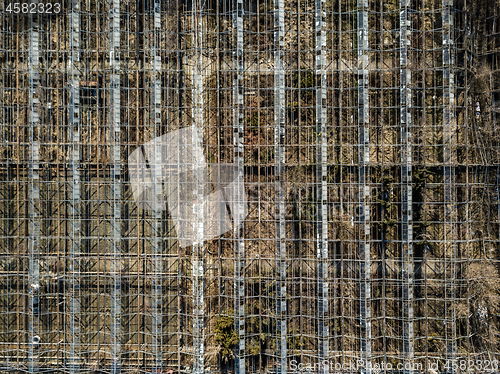 Image of Metal framework of greenhouses on a ground of drone view.