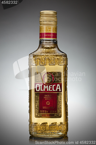 Image of UKRAINE, KYIV-DECEMBER 12, 2012. Olmeca Tequila Cold bottle from Jalisco, Mexico on a gray background.