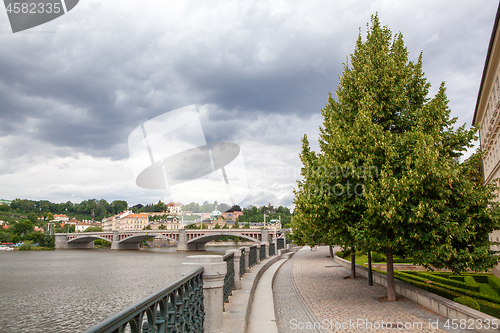 Image of Cityscape of Prague with view of river and bridge, Czech Republic.