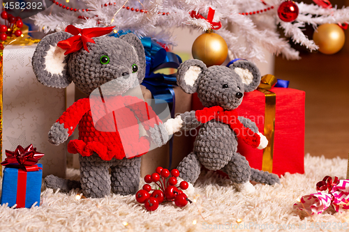 Image of Two funny plush mice under the Christmas tree