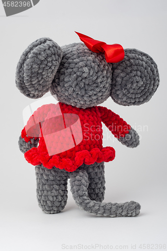 Image of Plush mouse with a red bow on its head, Rear view