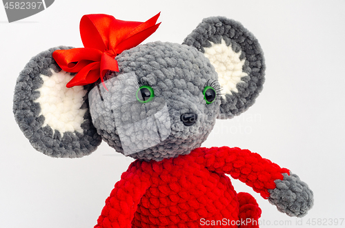 Image of Portrait of a teddy mouse with a red bow on its head