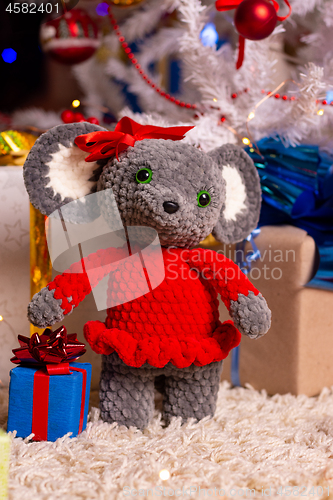 Image of Plush toy mouse girl on New Year\'s background