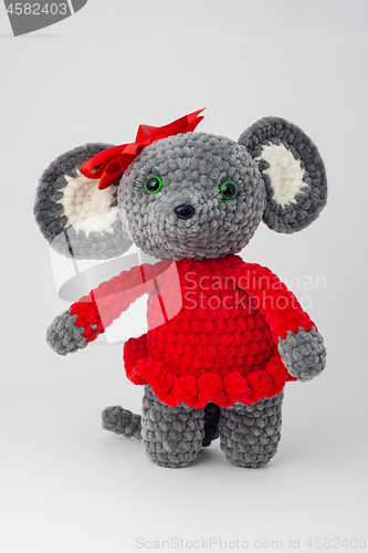 Image of Plush mouse with a red bow on its head