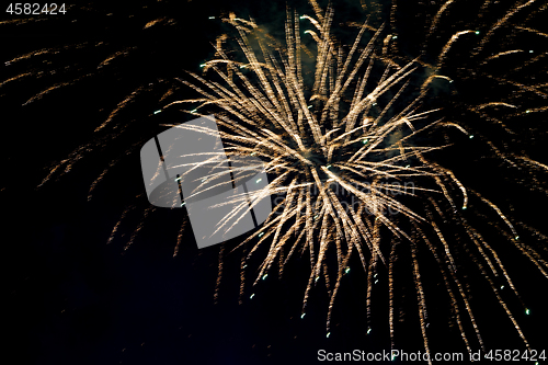 Image of Defocused golden frework lights.