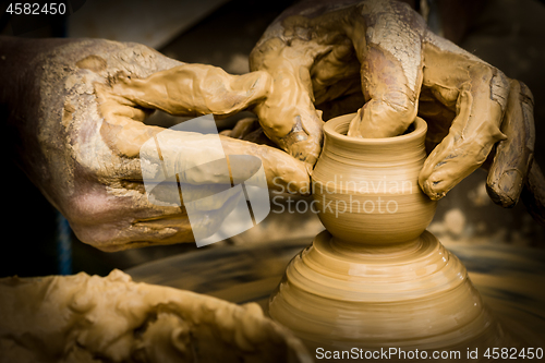 Image of Hands working on potter\'s wheel