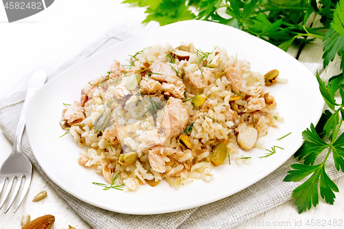 Image of Salad of salmon and rice in plate on white board