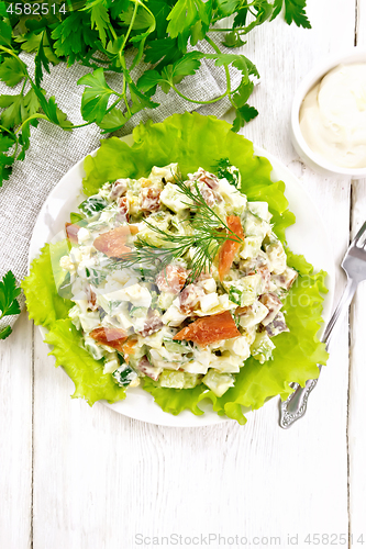 Image of Salad of salmon and avocado with mayonnaise on light board top