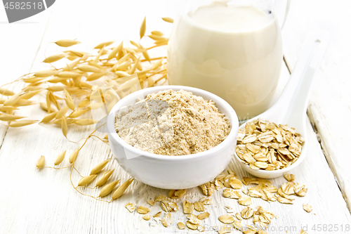 Image of Flour oat in bowl with milk on white board