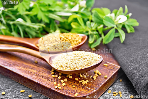 Image of Fenugreek in two spoons with herbs on board