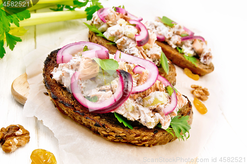 Image of Bruschetta with fish and curd on board