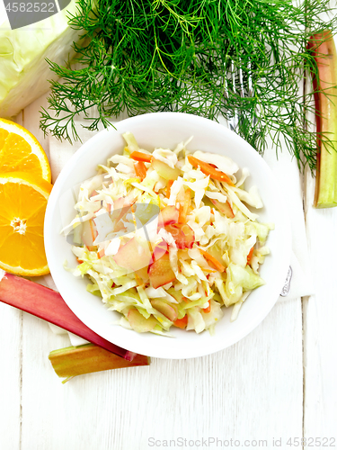 Image of Salad of cabbage and rhubarb in plate on light board top