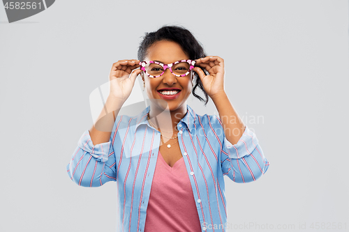 Image of happy african american woman with big glasses