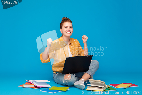 Image of happy student girl with laptop celebrating success