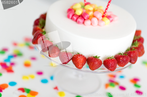 Image of close up of birthday cake with strawberries