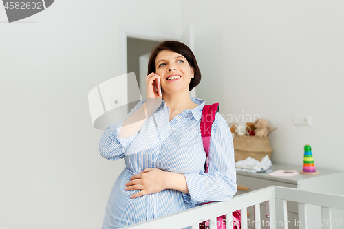 Image of pregnant woman with hospital bag and calling