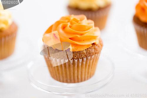 Image of cupcake with frosting on confectionery stand