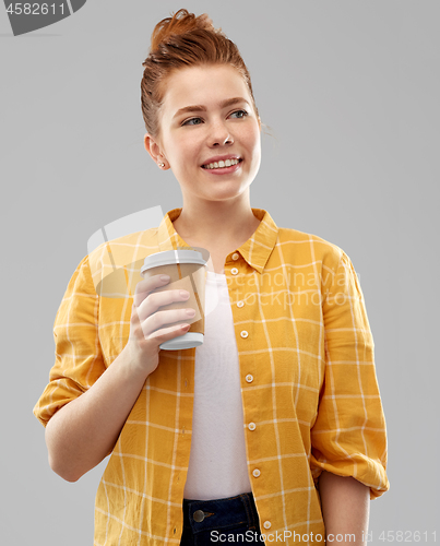 Image of happy redhead teenage girl with paper coffee cup